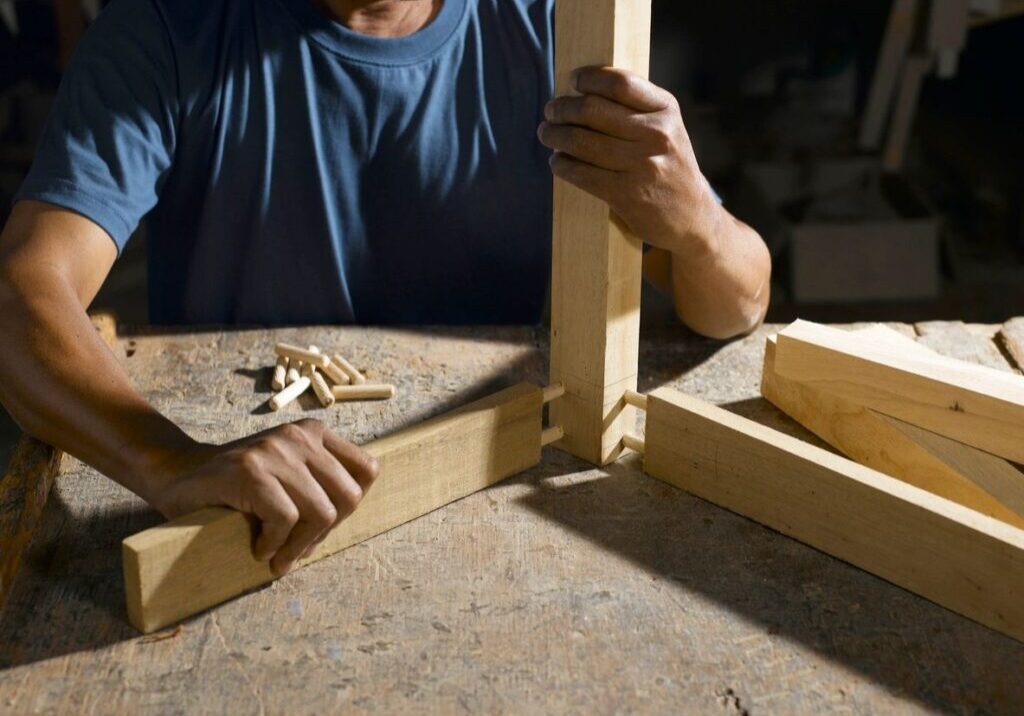 A person working on a wooden project